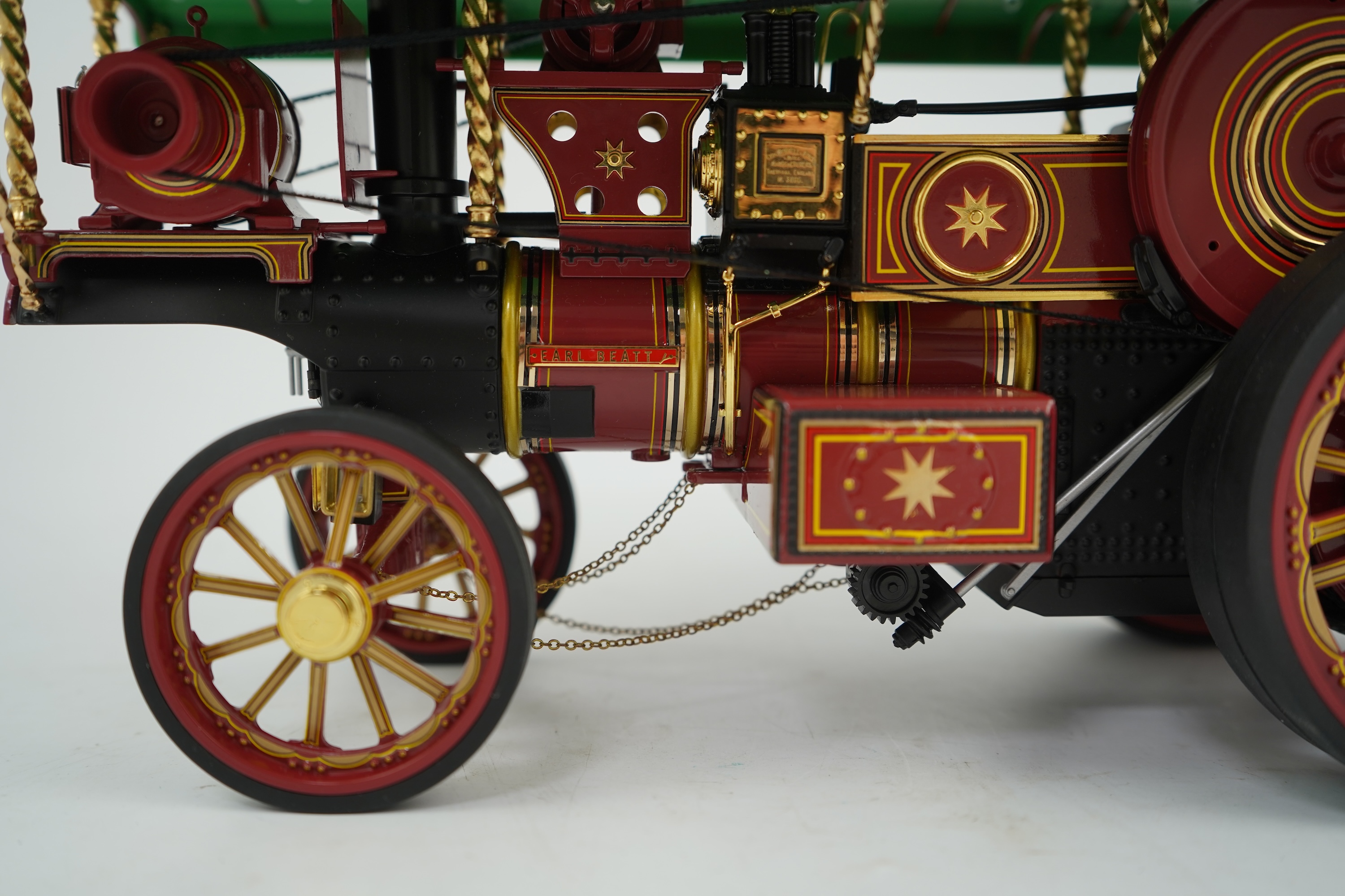 A Midsummer Models Ltd. 1:24 scale model of a Burrell Showman’s Engine, Earl Beatty, in ‘Anderson & Rowland’s Jungle Speedway’ livery, missing the original card box, but with an oak and Perspex display case
